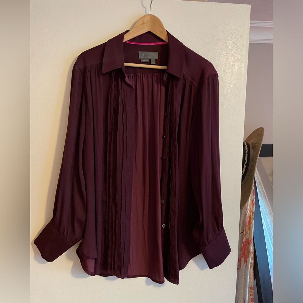 Plum colored oversized blouse from Anthropologie.